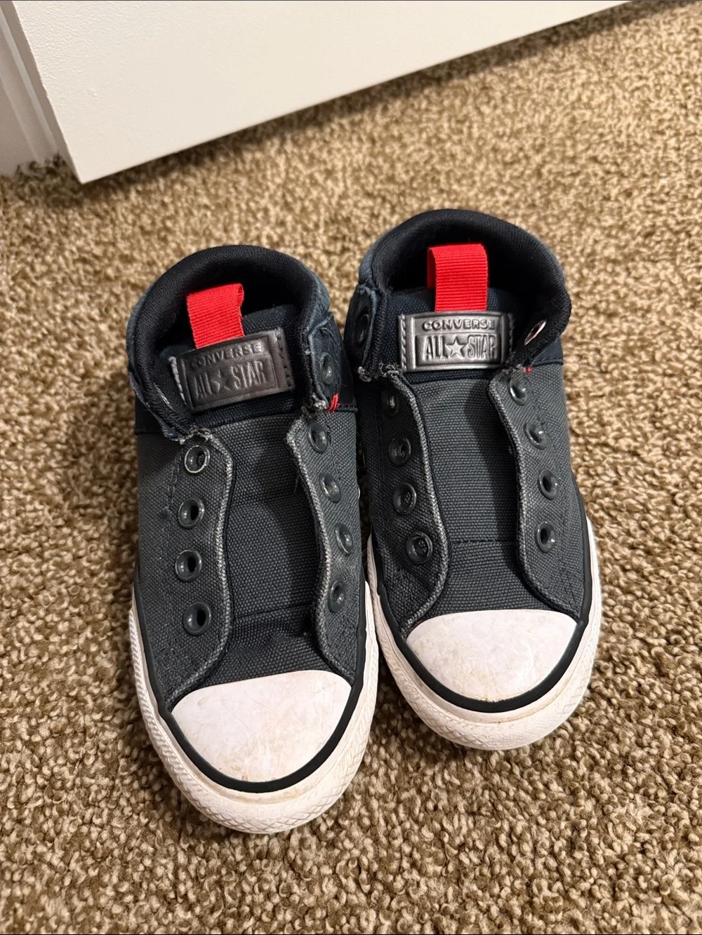 Converse Kids Black Canvas Slip-On Sneakers with Red Heel Loop